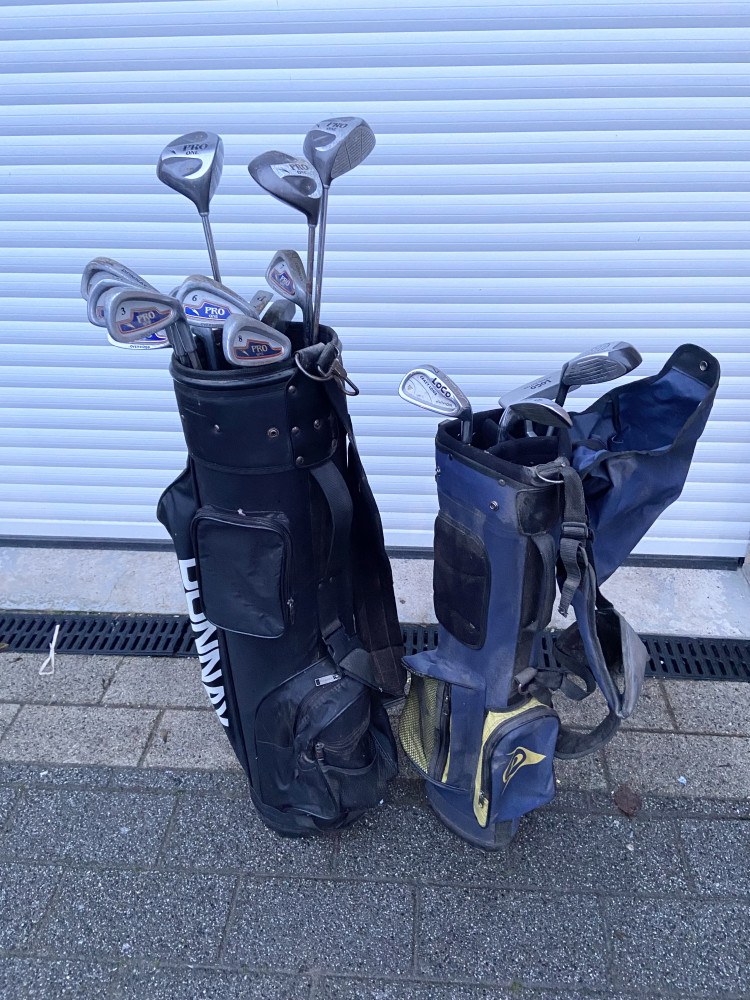 2 sets of golf clubs one children’s size