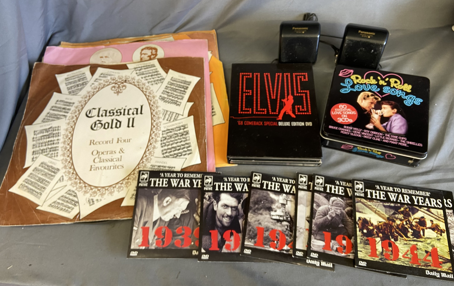 Vintage Classic vinyls, portable speakers, Elvis set, war DVDs and rock and roll CDs