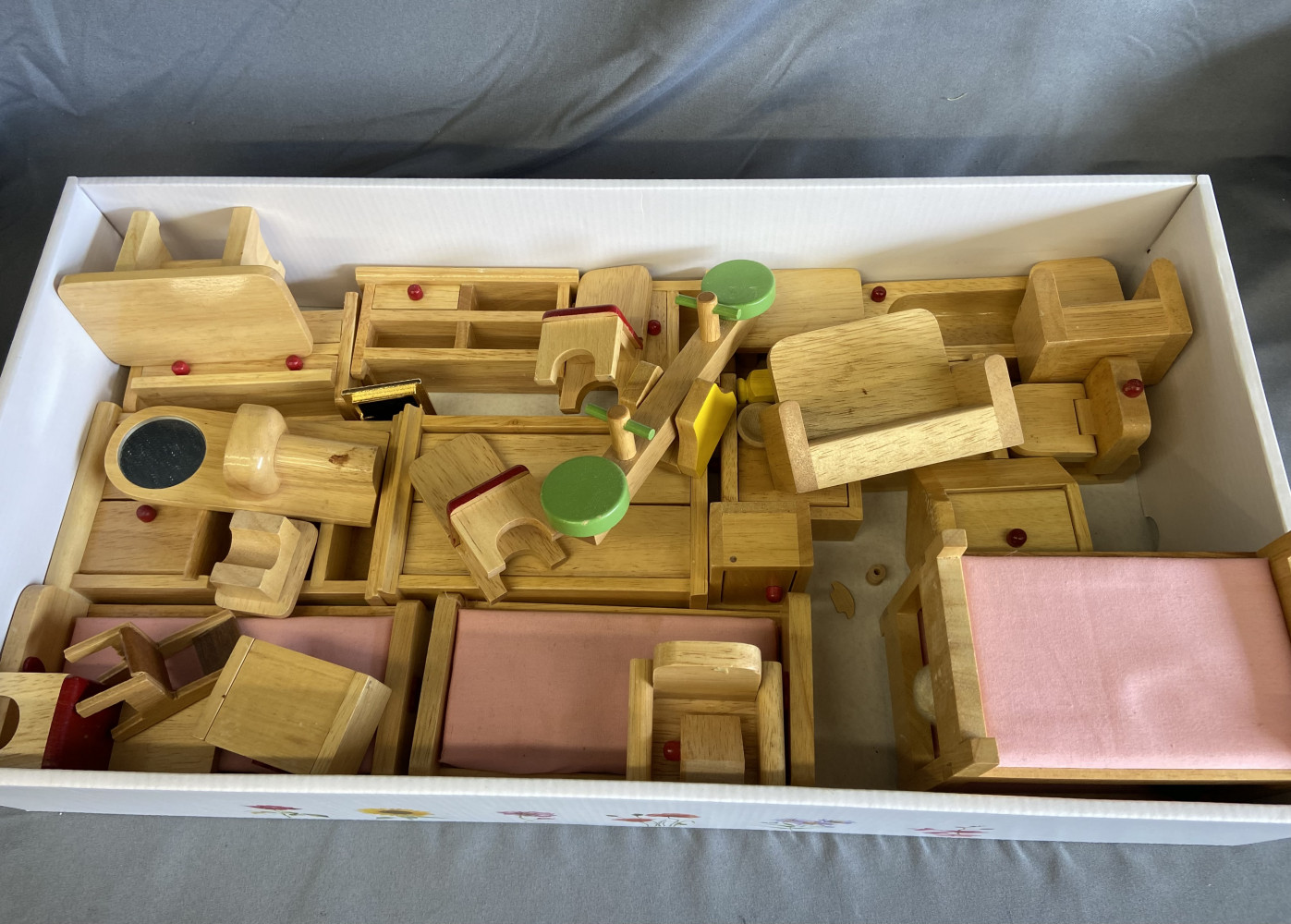 Box of wooden dolls furniture