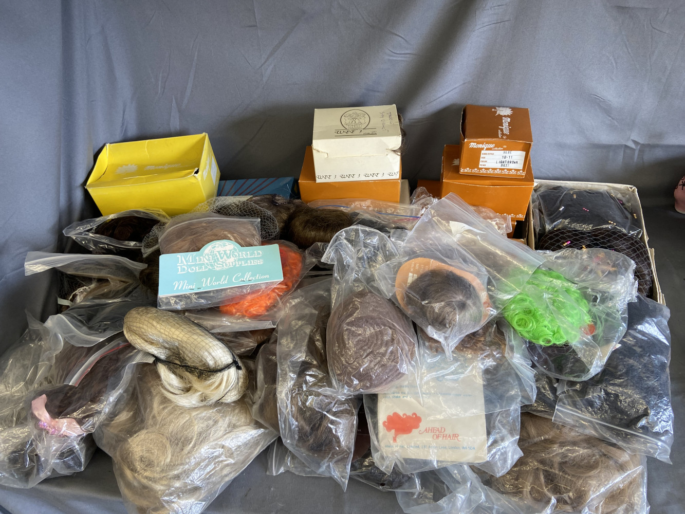 Approximately 50 Dolls wigs or hair pieces