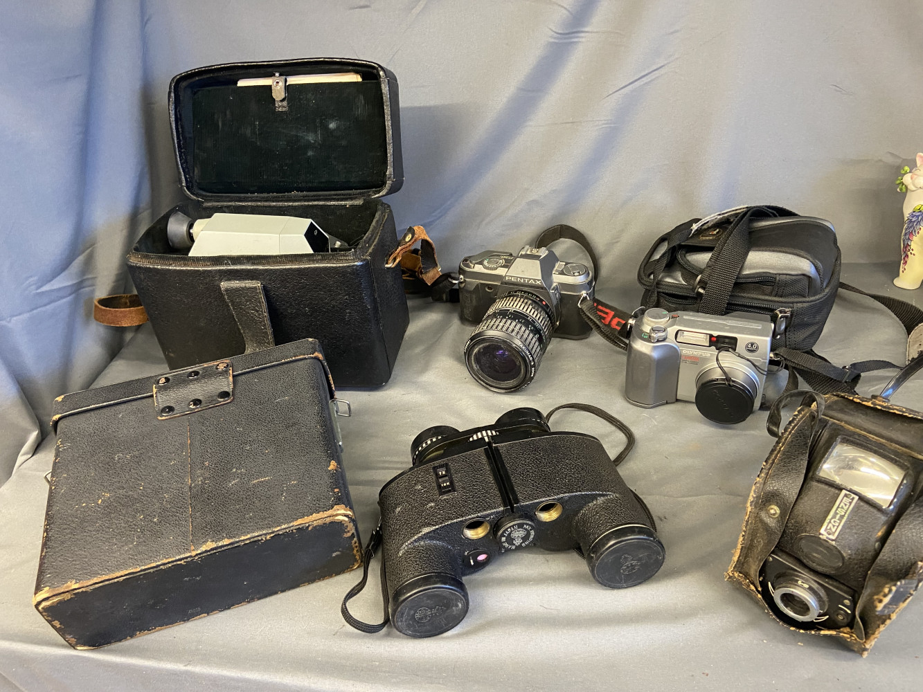 Olympus Camedia C-4000 Zoom digital camera, Pentax P30t 35mm film camera, Quarz-5 amateur cine camera from the USSR, vintage Ensign Ful-Vue camera and vintage pair of Tasco Executive binoculars
