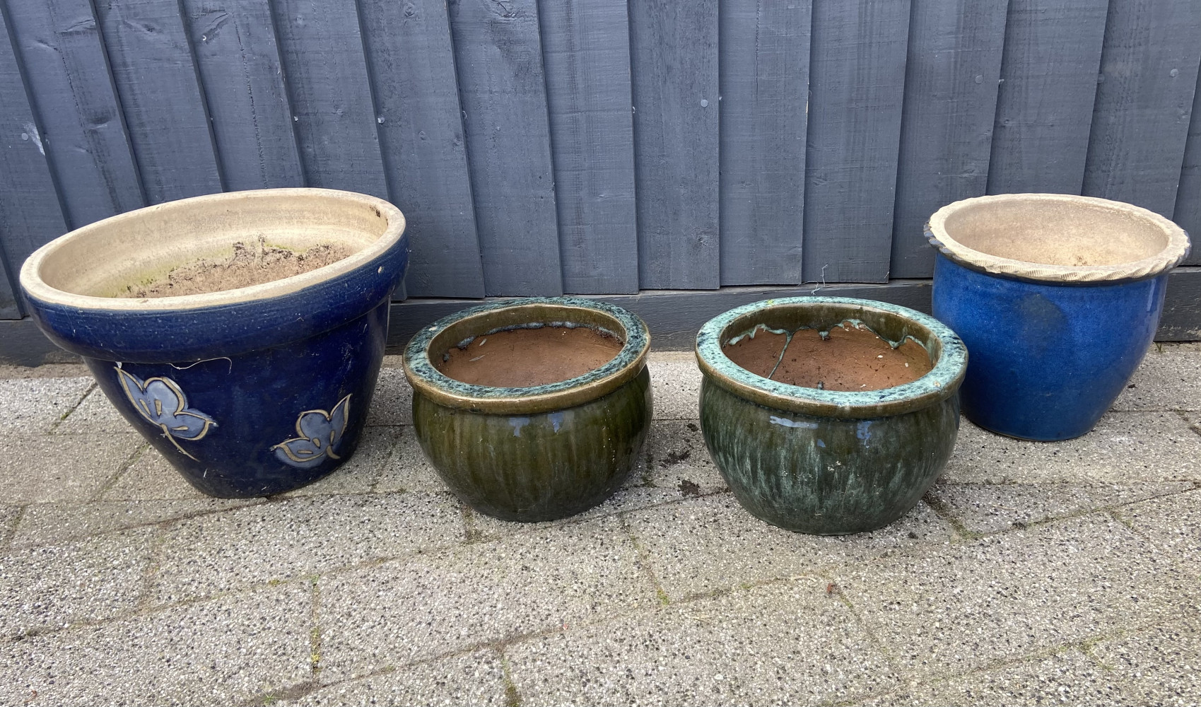 Pair of green glazed garden pots and two others one large
