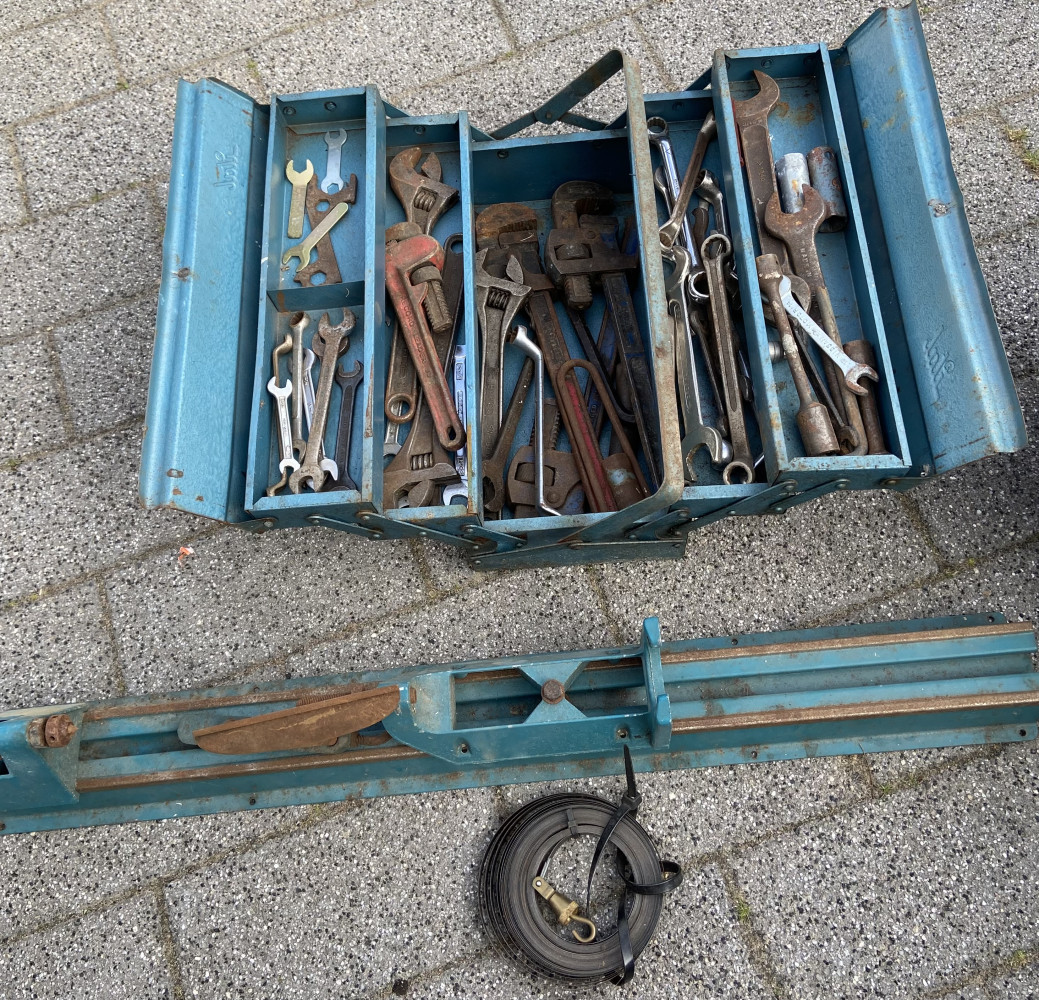 Tool box full of large sets of Stilsons and other tools and lathe attachment