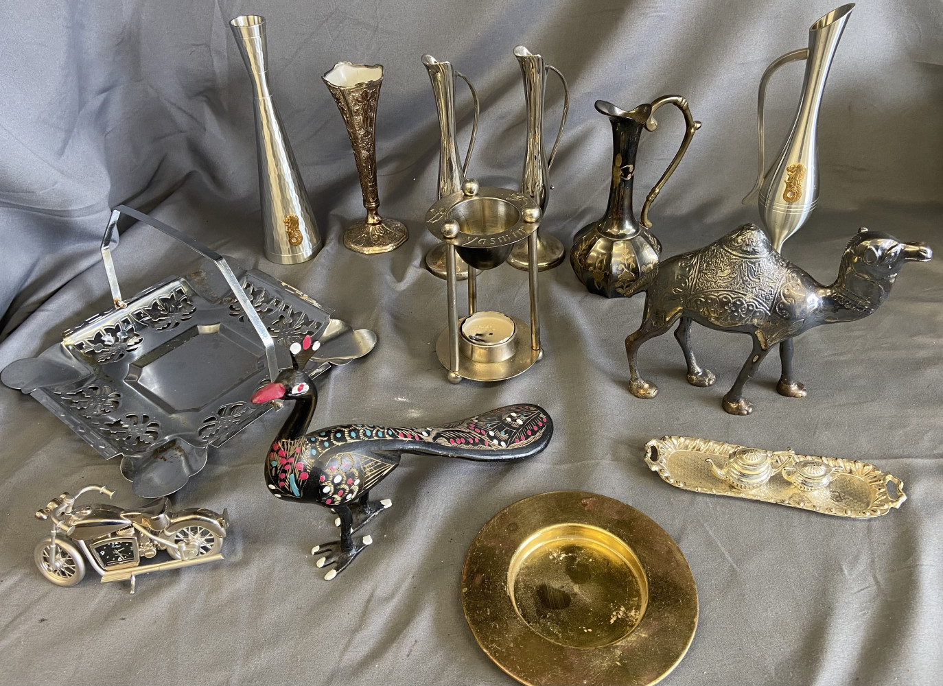 Metal vases and bud vases, metal camel, brass painted peacock and other metal items