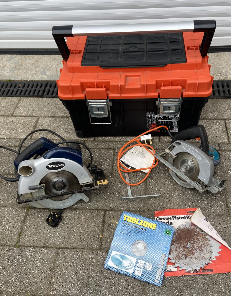 Large plastic heavy duty tool box with two working circular saws