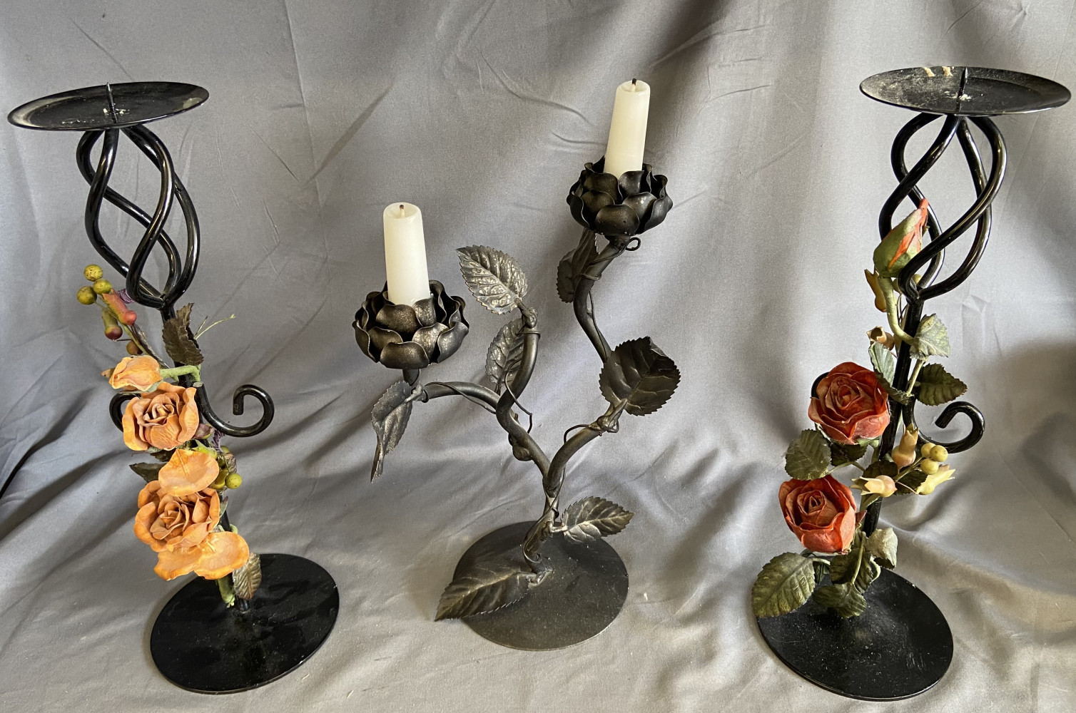 3 large metal candle sticks