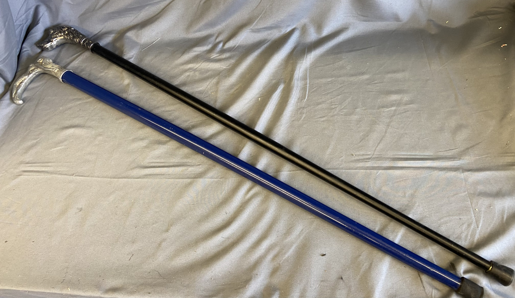2 walking sticks one marked “Robert Clark 925”