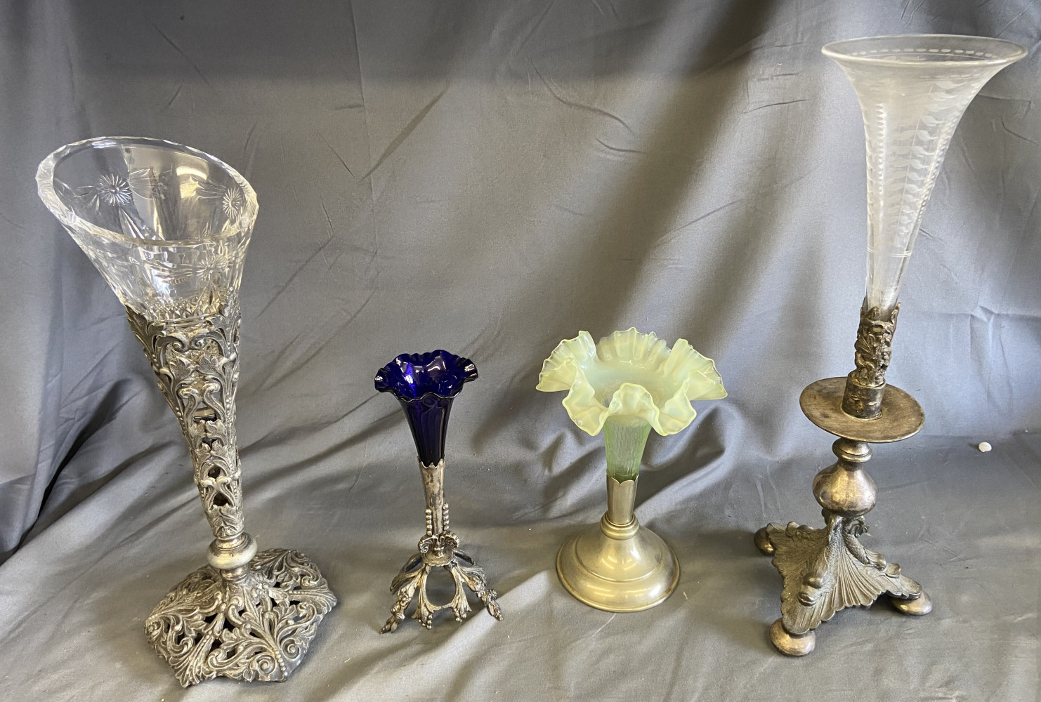 Collection of antique trumpet-shaped bud vases, various metal bases and uranium glass tallest one 37cms