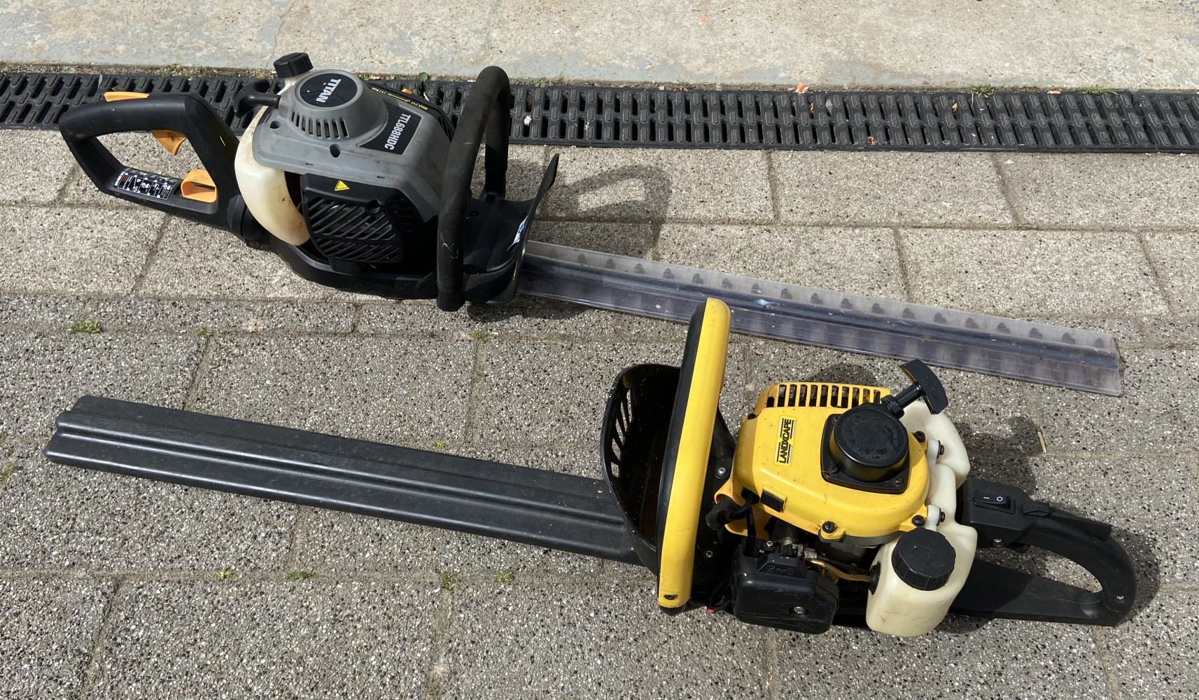 2 petrol hedge trimmers, Titan and Landxcape.