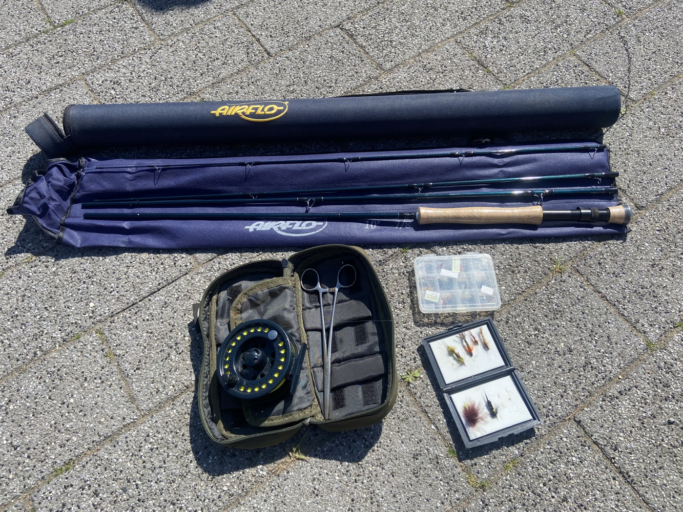 Fly fishing rod, reel, flies and other accessories