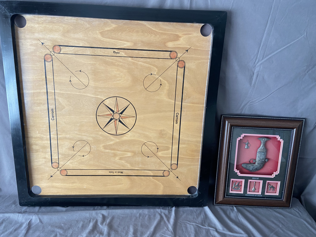 Wooden carrom board, and wall display featuring a traditional ceremonial dagger