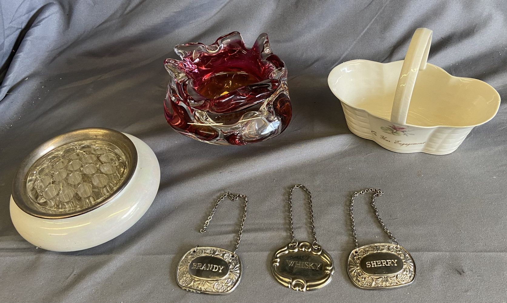 Silver plated bottle labels, ceramic basket, Czech art glass ashtray bowl and Royal Daulton flower frog
