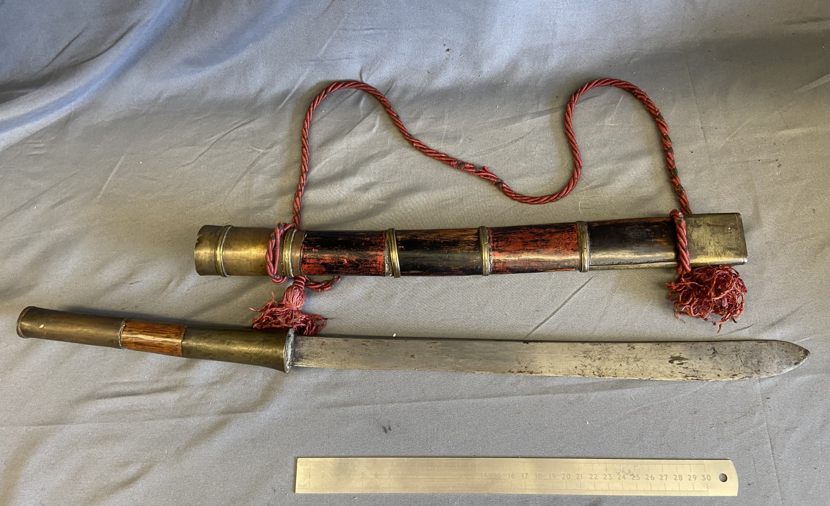 an antique Burmese Dha sword with its original scabbard, dating from the 19th century