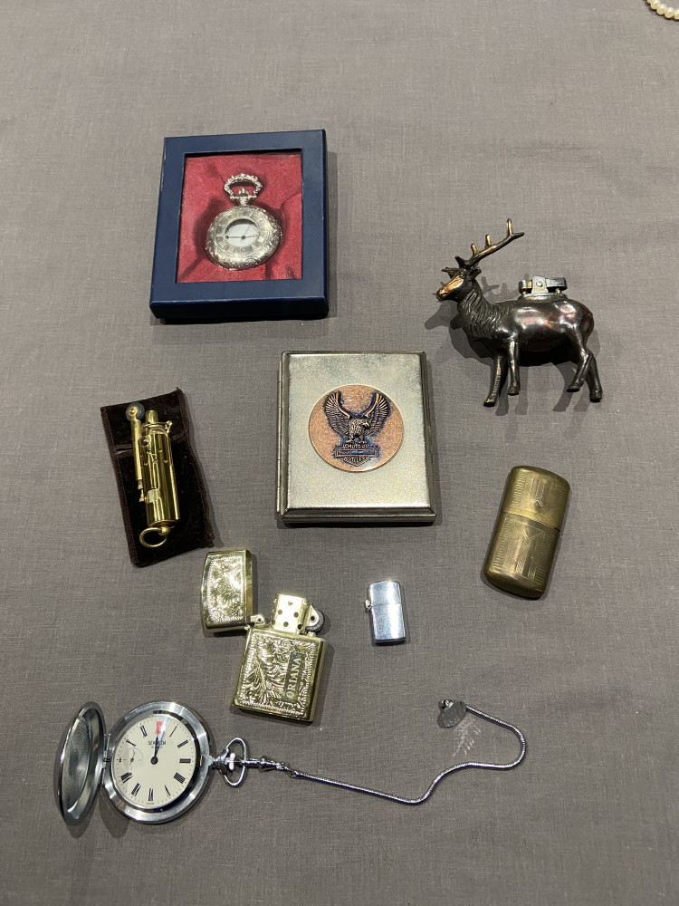 Selection of lighters in need of repair, metal case and two pocket watches