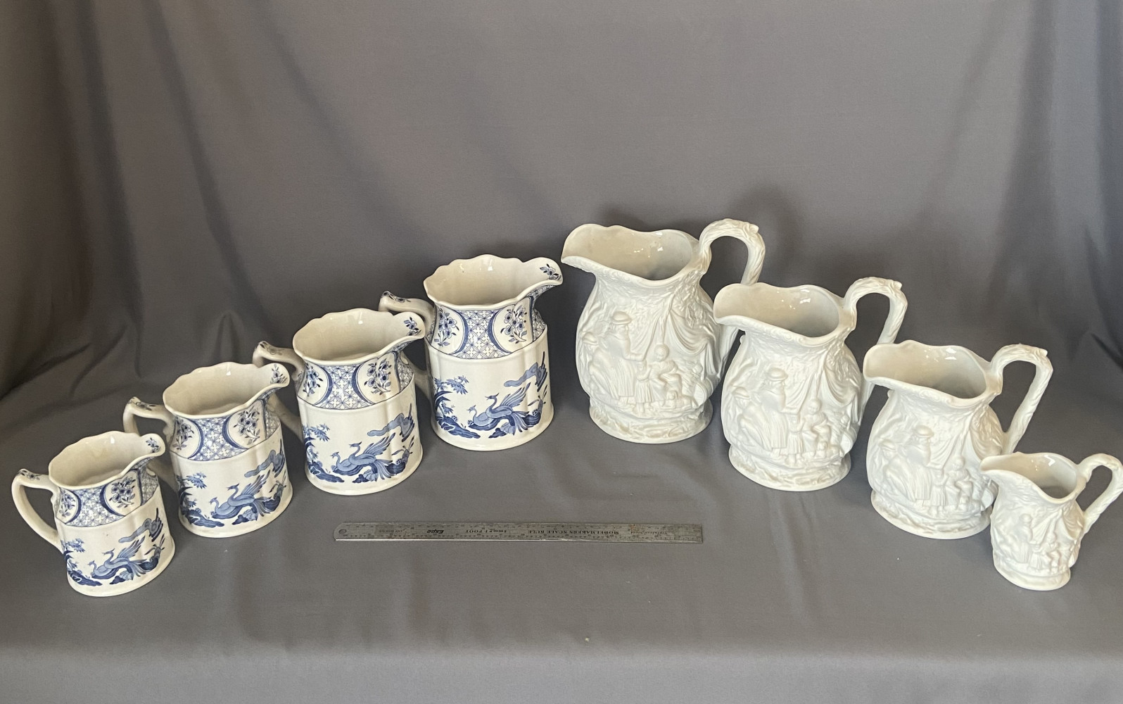 Set of four antique Furnivals Limited "Old Chelsea" pitchers and four vintage white Portmeirion porcelain pitchers from the British Heritage Collection