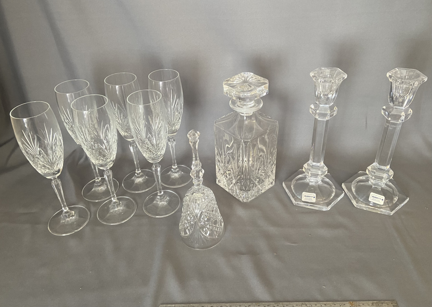Crystal items including candle sticks, bell and other glass items