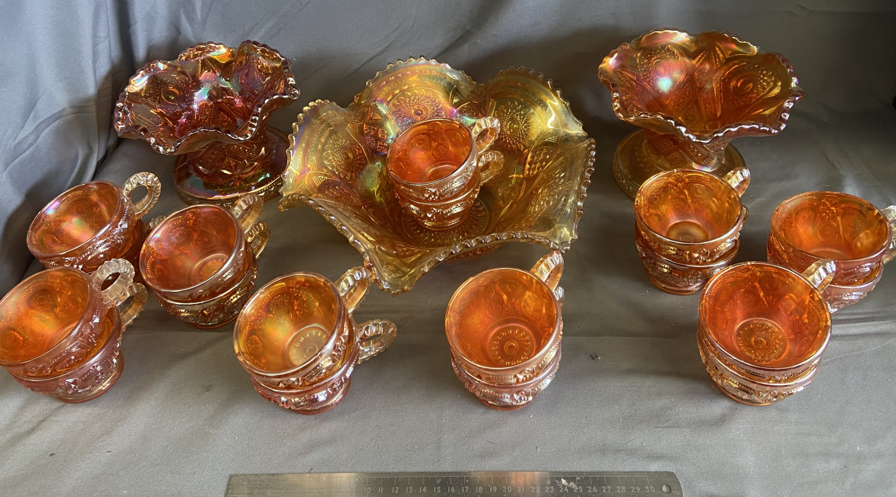 Large lot of carnival glass, 3 bowls and 18 cups