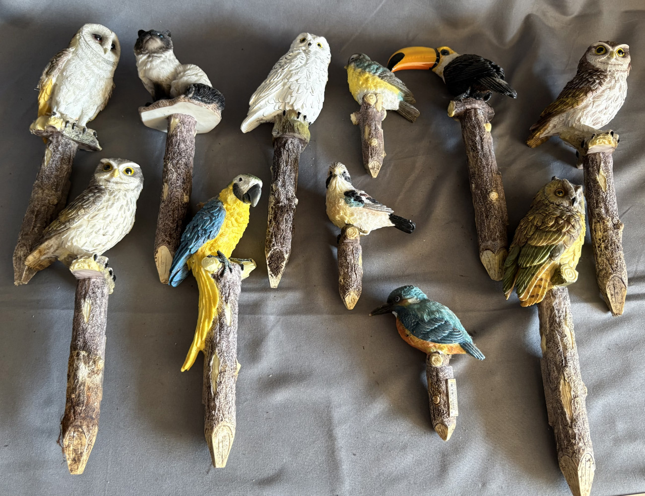Bird and cat resin figures on stakes for garden decoration