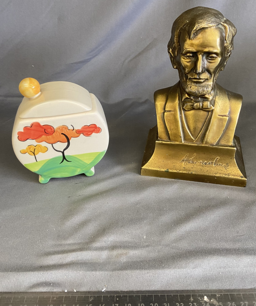 Spelter brass plated bust of Abraham Lincoln and past times Clarice Cliff inspired pot with lid