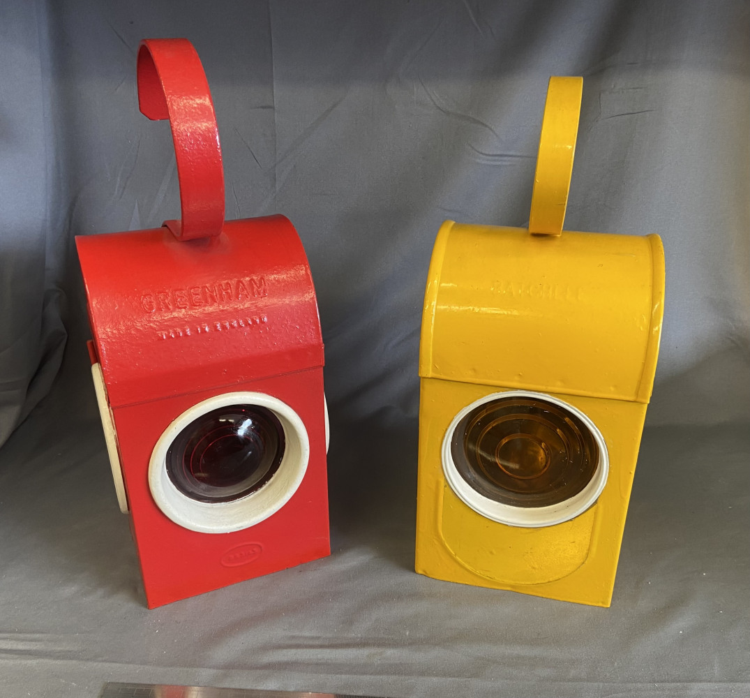 Two Vintage Railway Lanterns both with Paraffin Burners one stamped Batchlee and the other Greenham