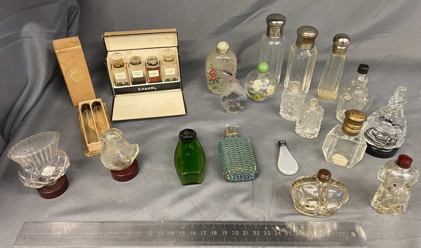 Large collection of miniature perfume bottles including Chanel set