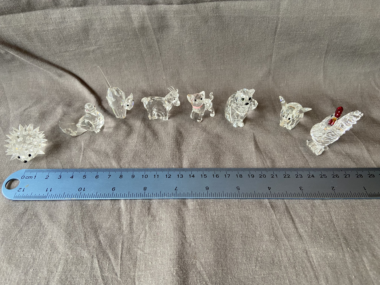 Small Swarovski figures, hedgehog oval small 013989, Dove 191696, Tom Cat Figurine 7634, Zodiak Ziege Zodiac Goat 275438, Kitten Standing 1193537, Sitting Cat 160799, elephant 7640 and 247759 Rooster