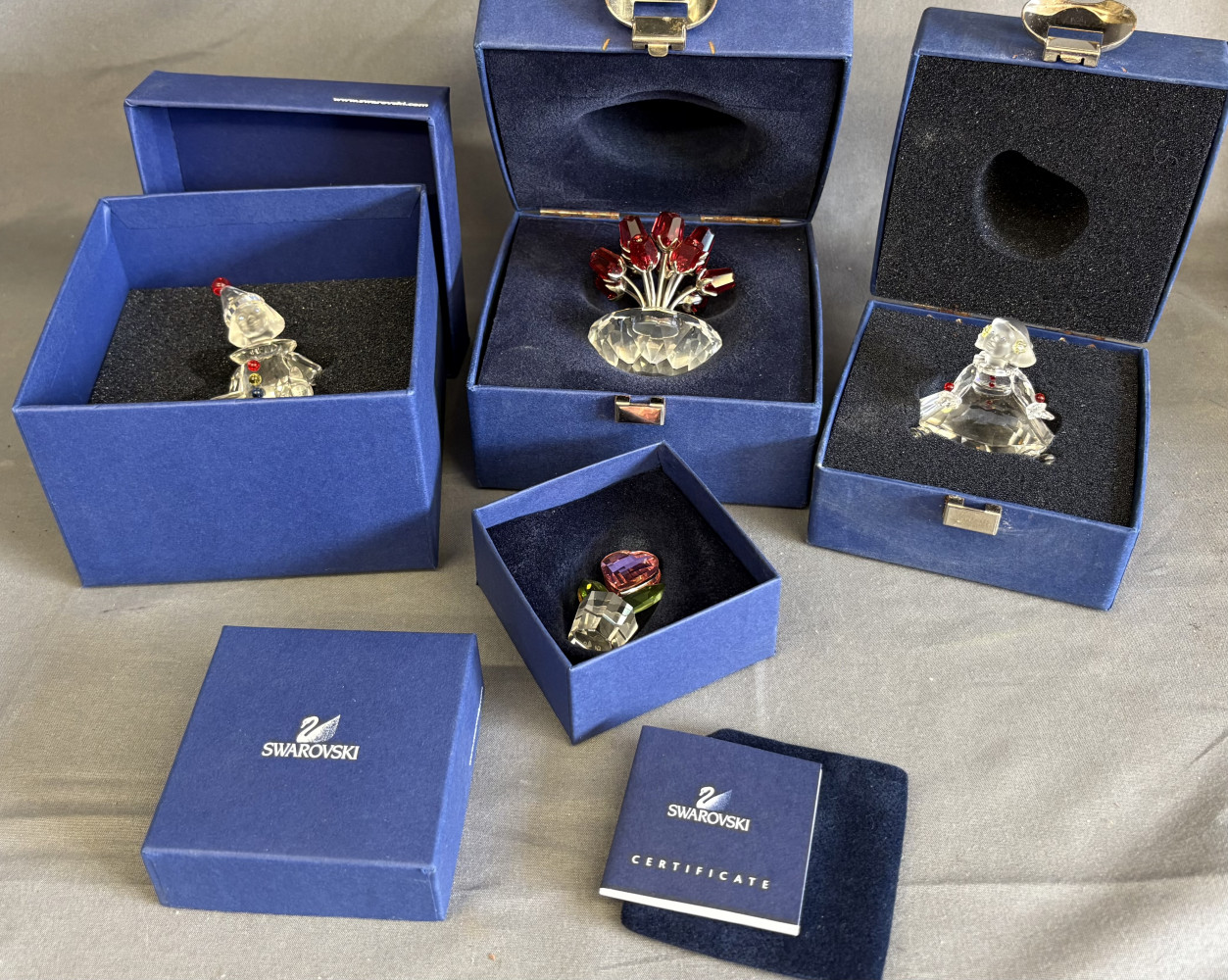 Swarovski Figurines, 626247 Clown Girl, Puppet Clown 217207, Red Rose vase / pot 283394 and Moments Pink Heart Flower 842858