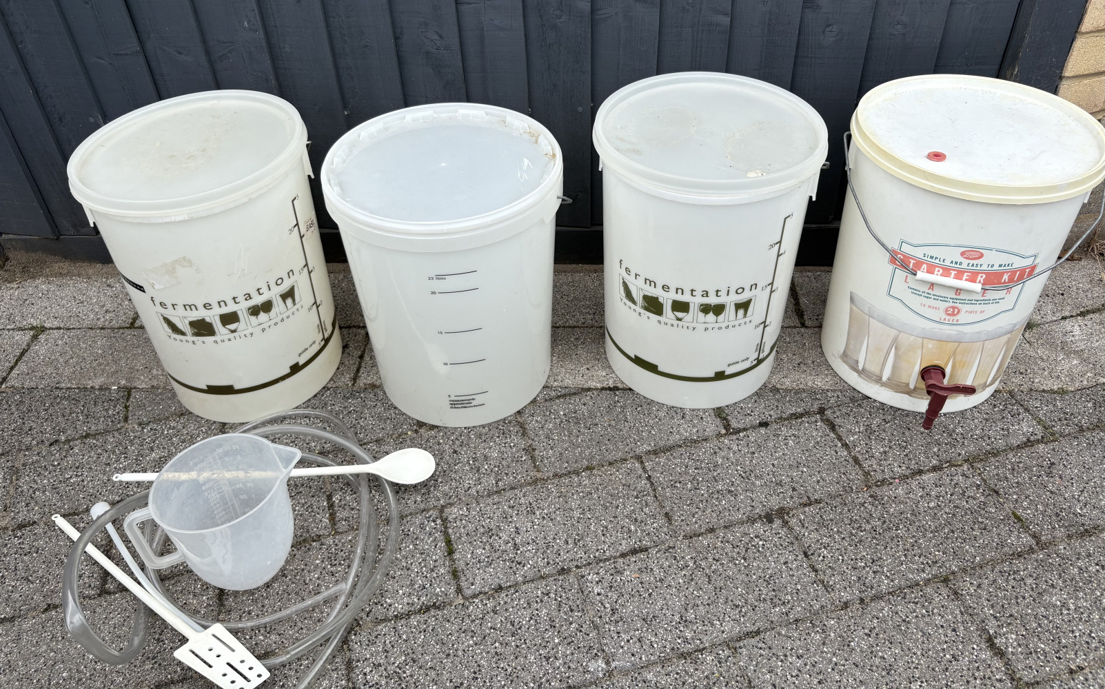 Four fermentation vessels for brewing and accessories