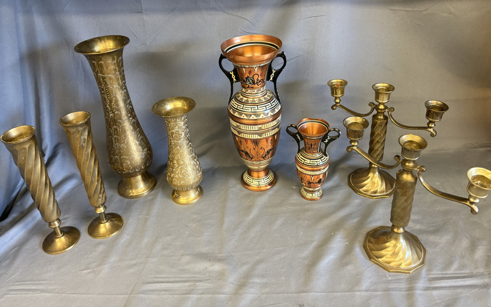 Brass candle sticks, brass vessels and copper jugs
