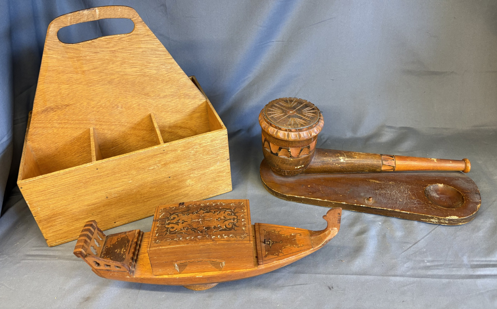 Wooden rotating musical boat, pot in shape of pipe and wooden organiser