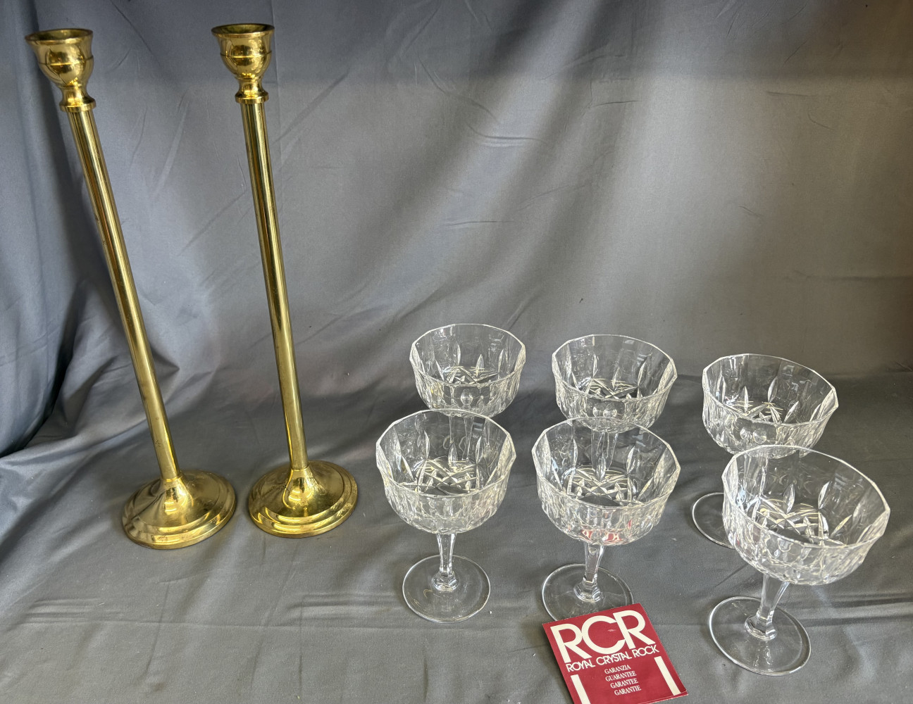 2 tall brass candle sticks and 6 crystal glasses