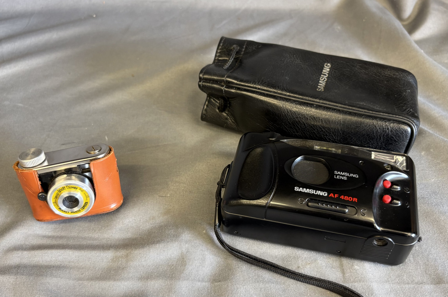 vintage 1950s Kunik "Mickey Mouse" subminiature camera And Samsung camera