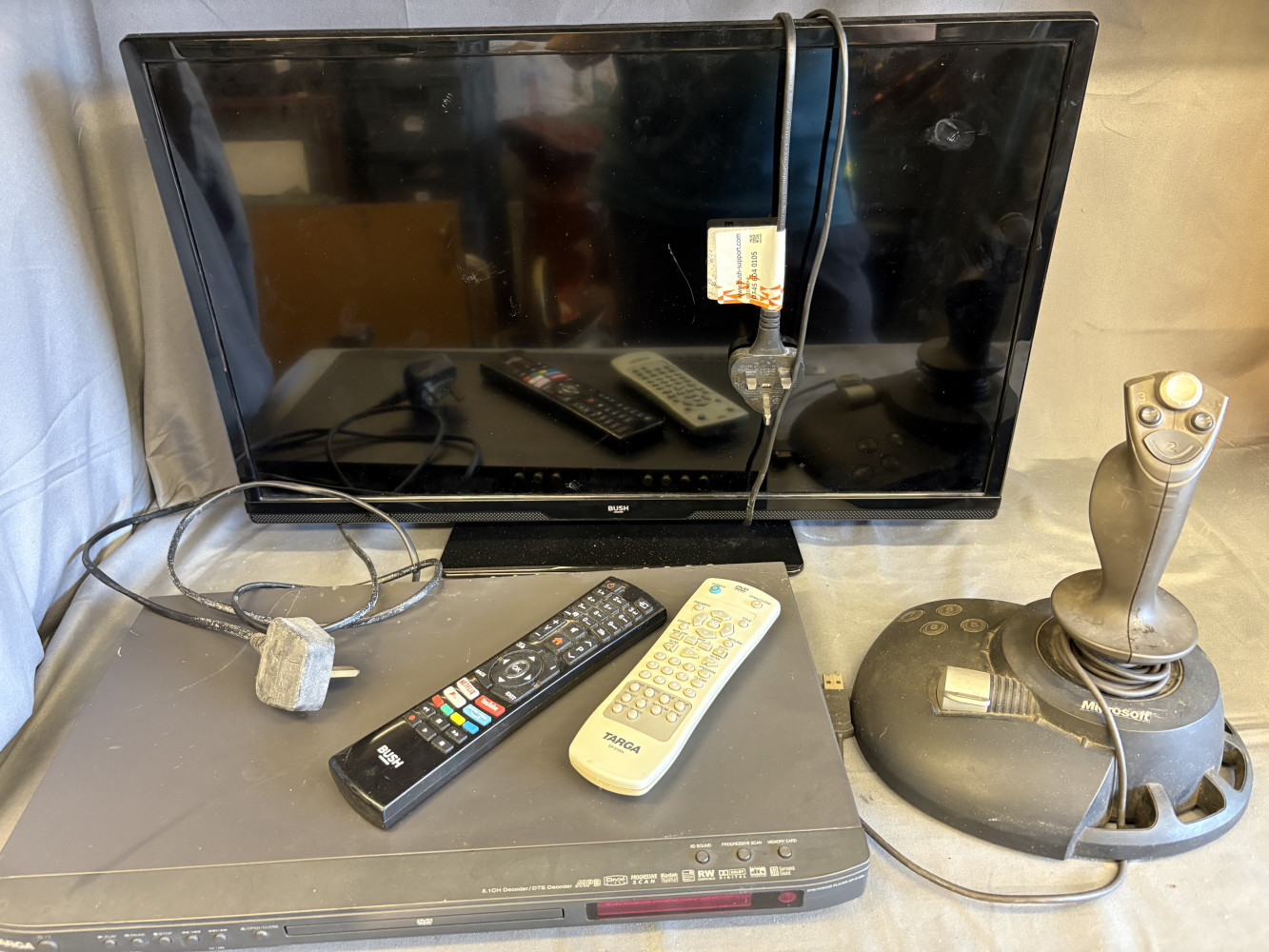 Bush TV, dvd player and joystick and two remotes