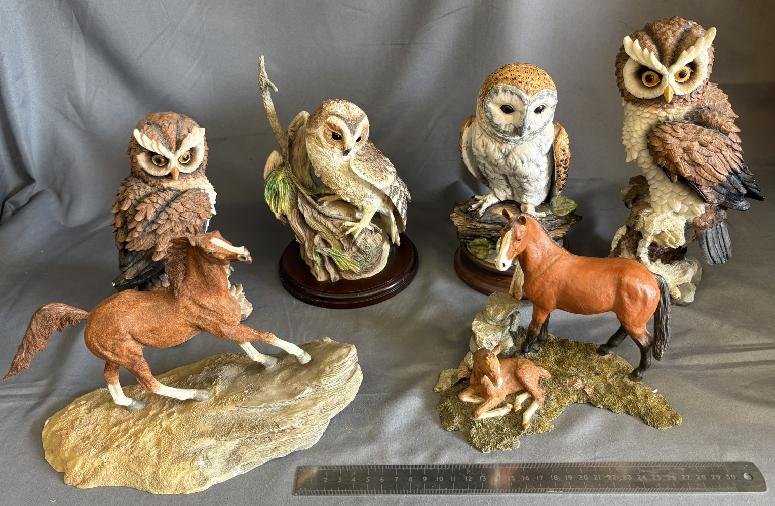 Four large owls and two horse figurines