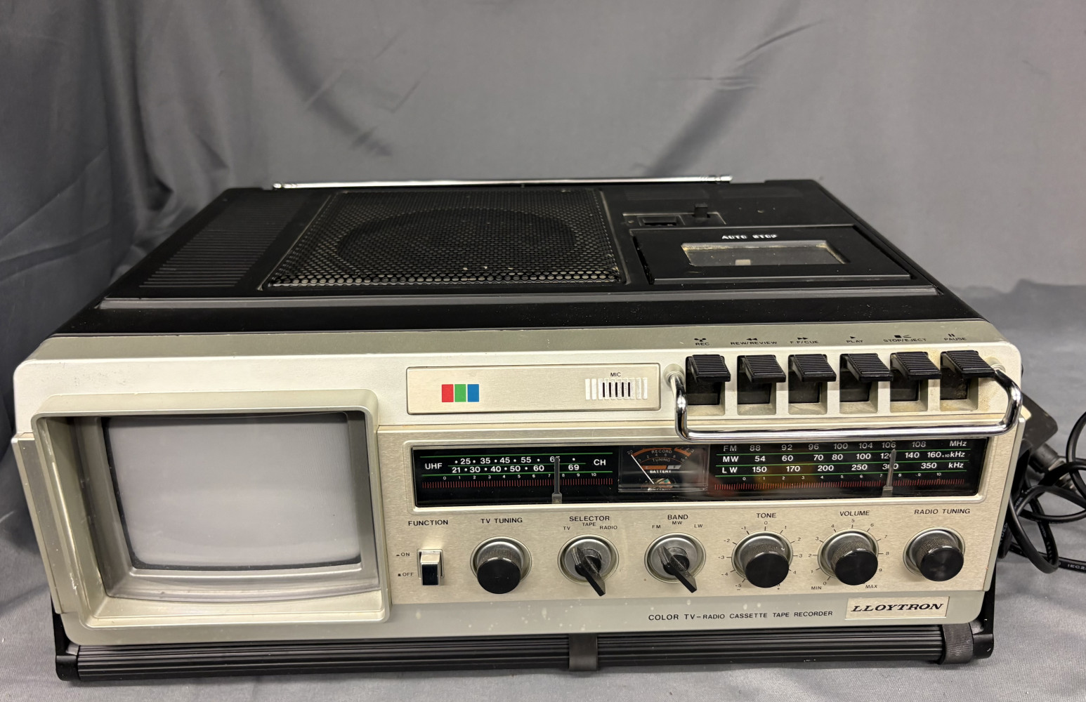 Vintage portable Lloytron T-055 features a 5-inch screen combined with a radio and cassette recorder