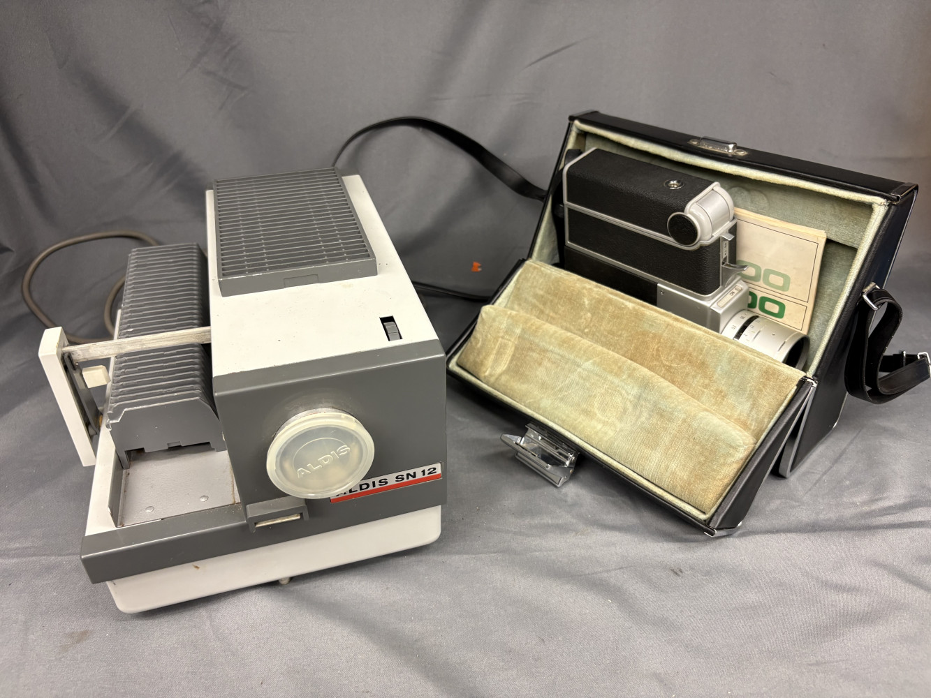 Vintage Sankyo Super CME series Super 8 cine camera and a Aldis SN12 semi-automatic slide projector