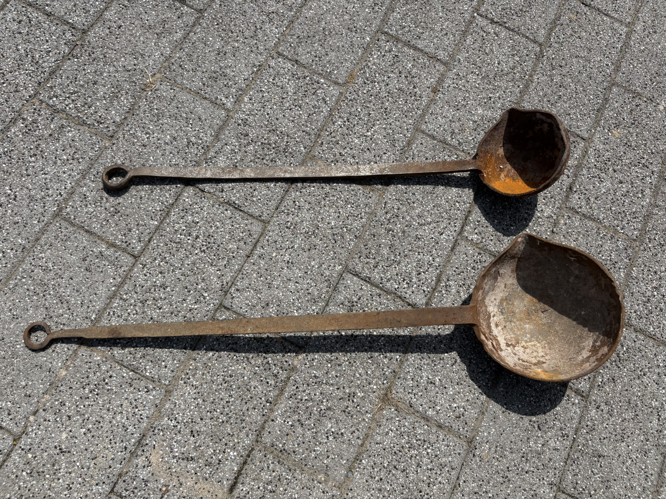 2 very large heavy antique smelting ladles, largest one 90cms long