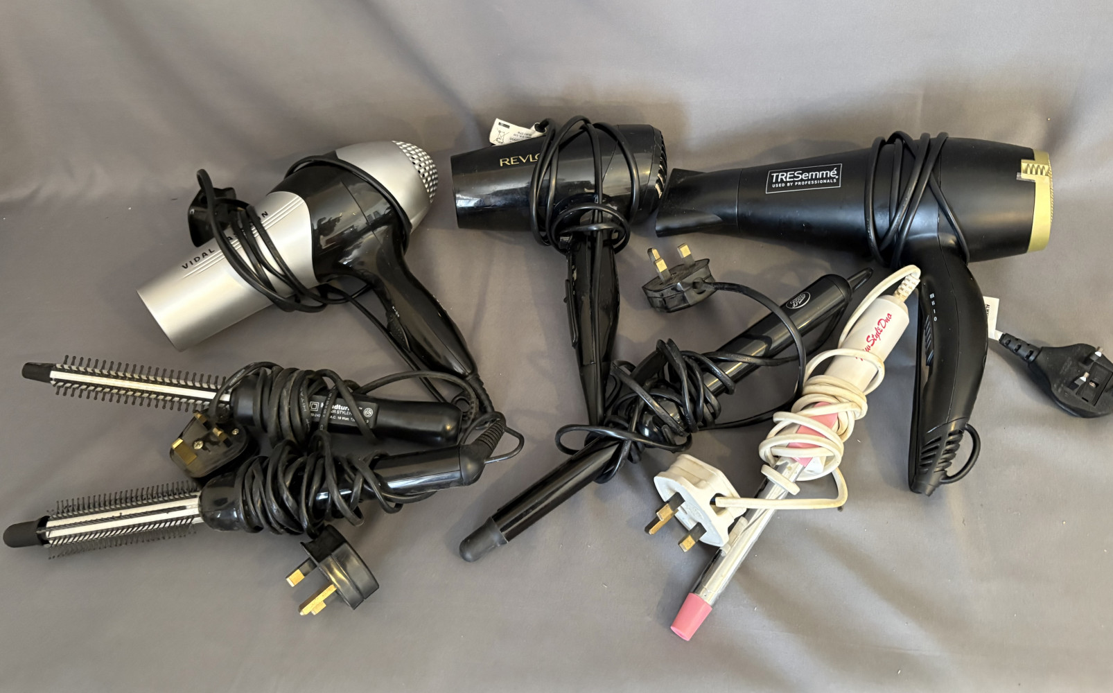 3 hairdryers and 4 other hair accessories