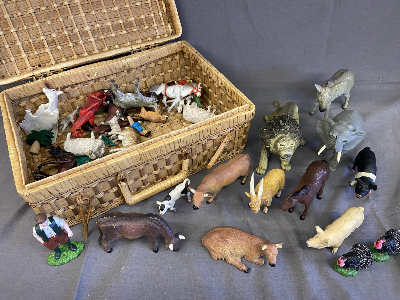 Wicker case and plastic animals 