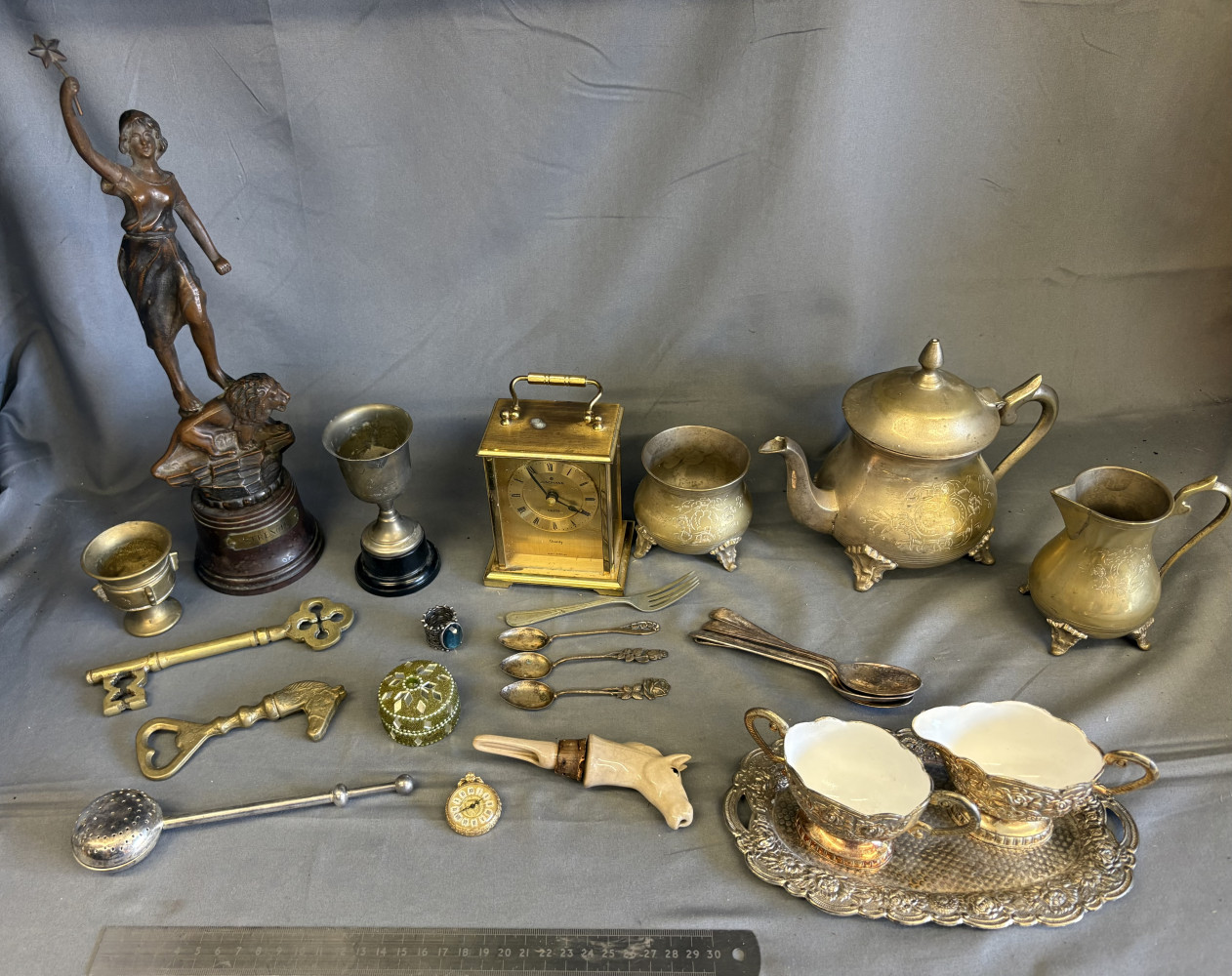 Silver plated tea set, mixed brass and metalware, clock, statue and other metal items