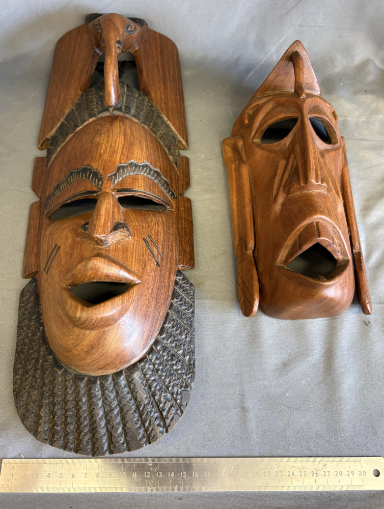 Two large repo tribal masks