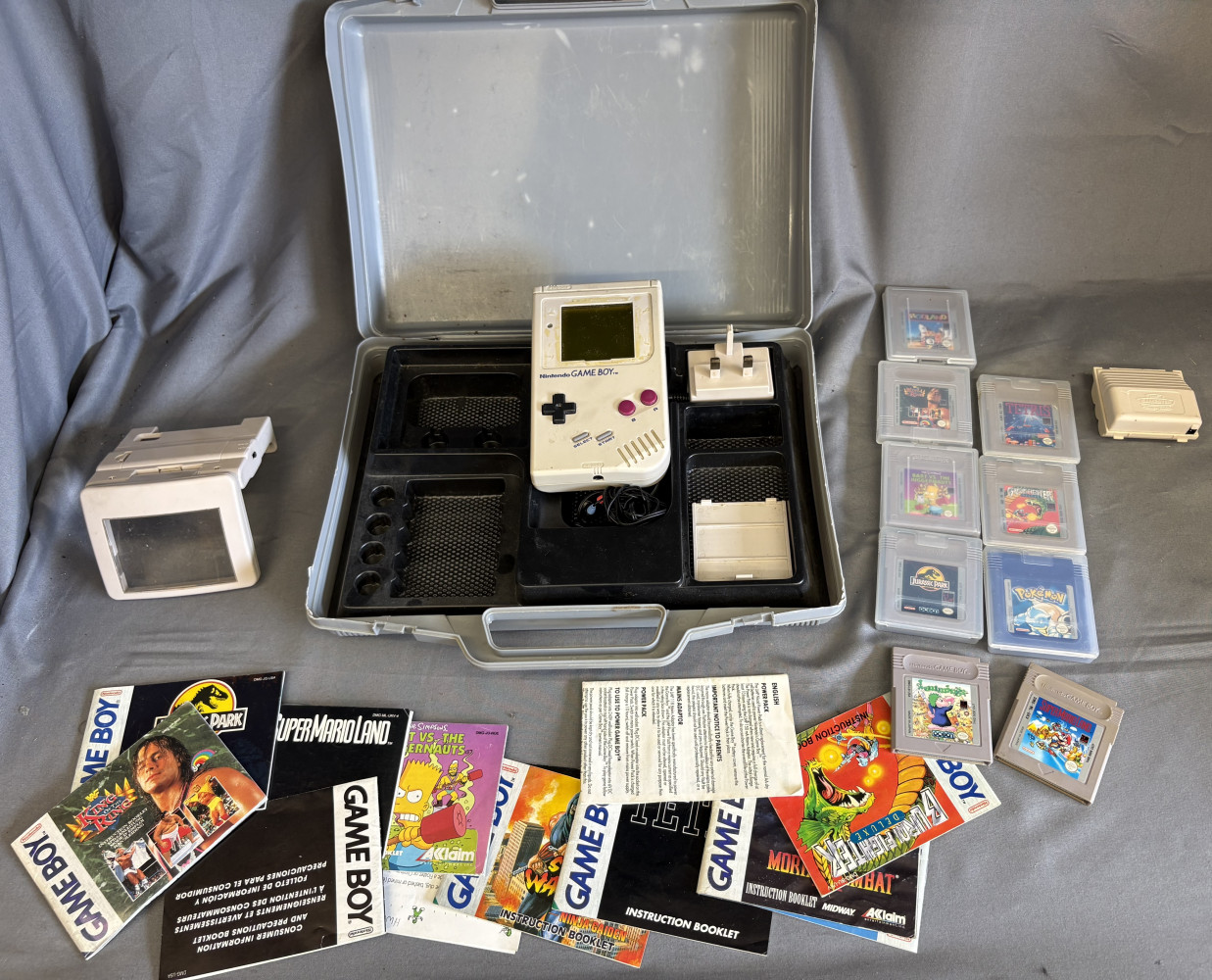 Game boy with missing screen with games and other accessories