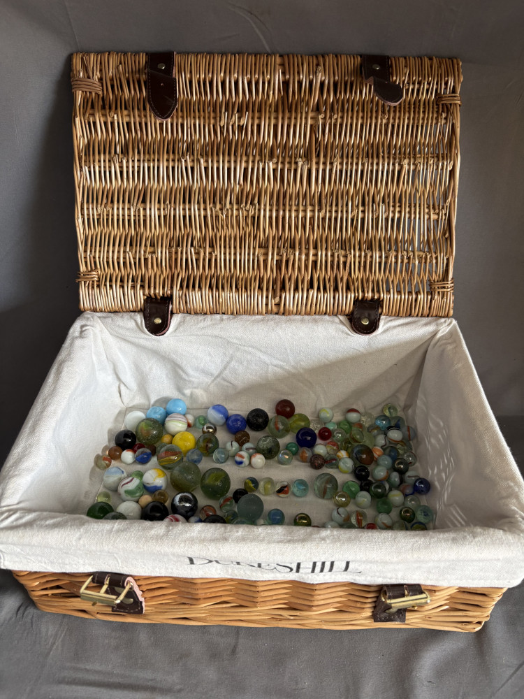 Little hamper with bag of vintage marbles