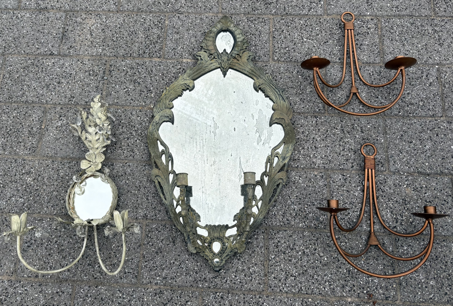 Two Repro French cast iron mirror features intricate, weathered foliage details and built-in candle holders And two copper wall candle holders