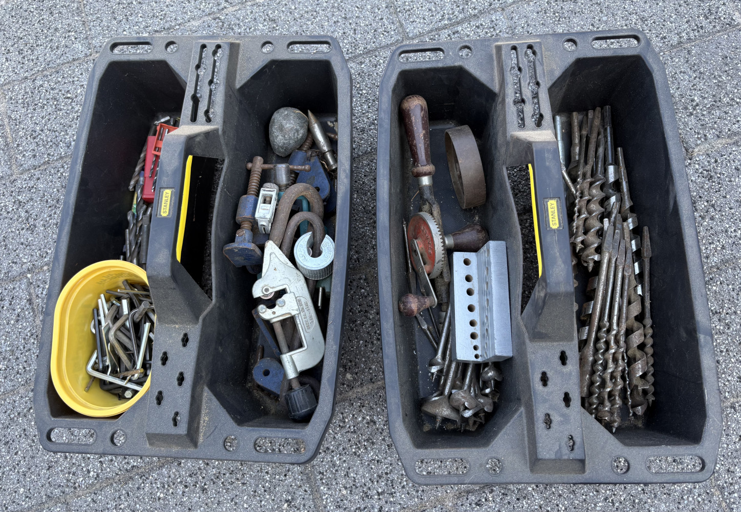 Two Stanley Tools Totes loaded with tools