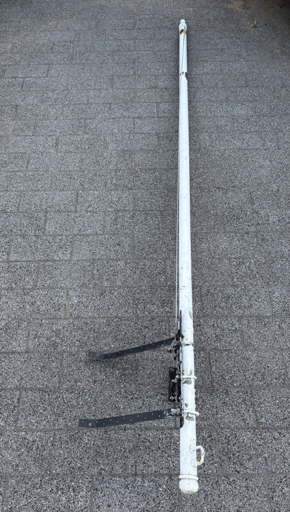 Metal flag pole with wall bracket