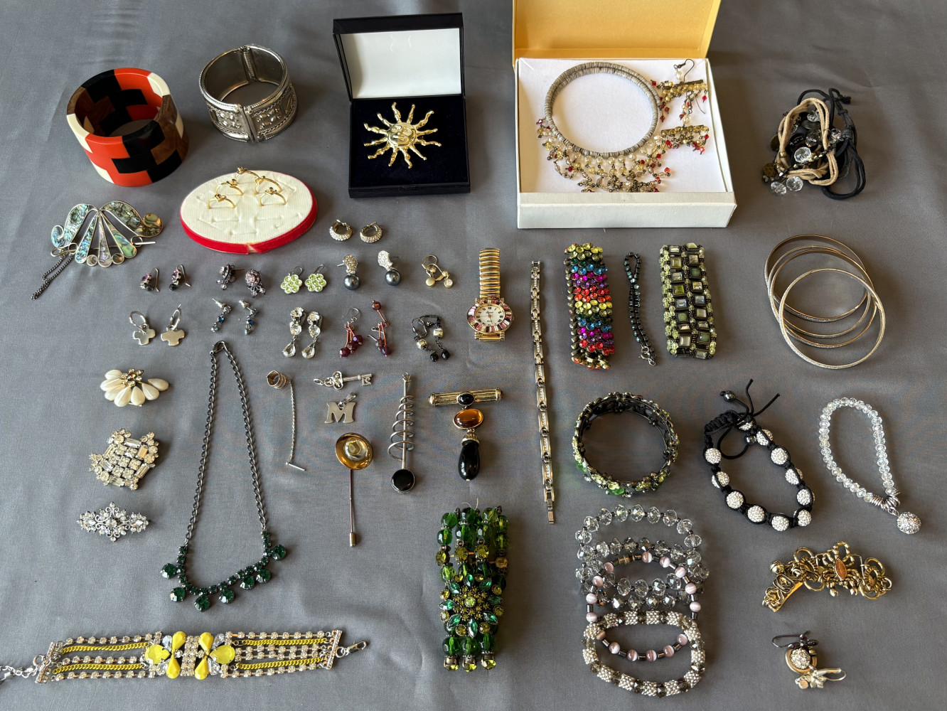 Large costume jewellery lot containing brooches, bangles, necklaces and earrings