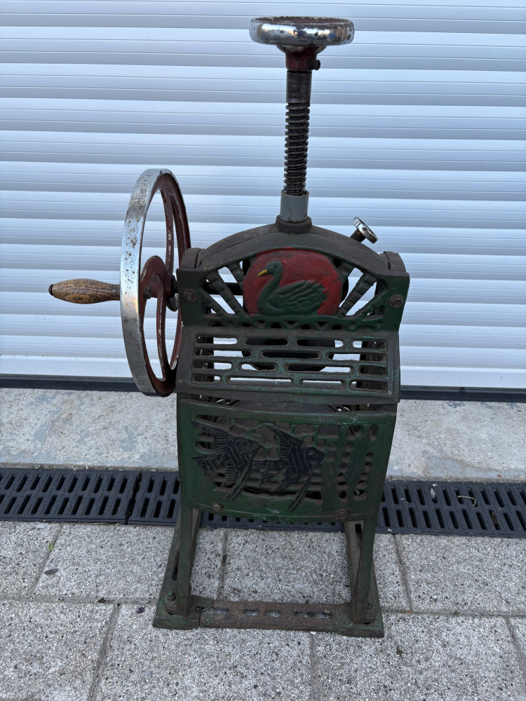 Vintage cast iron hand-cranked snow ice shaver machine, often referred to as a "swan" ice shaver. valuable item