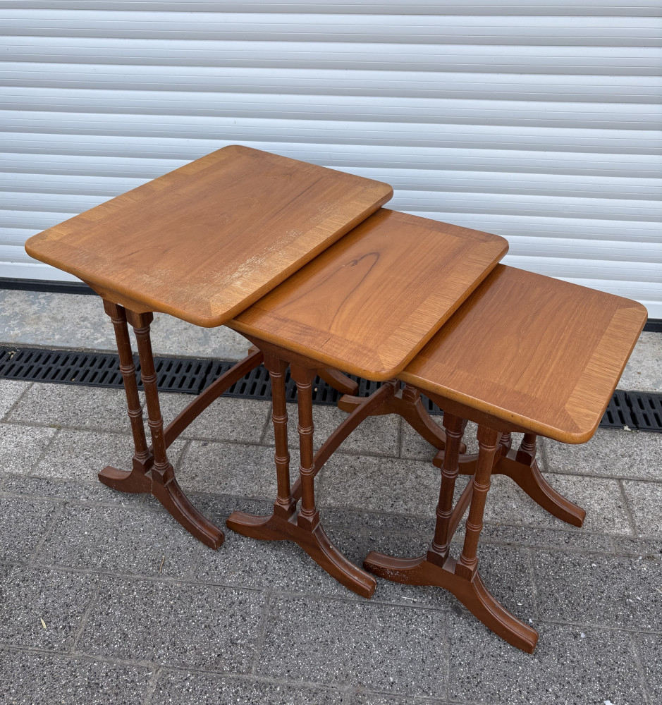 Vintage mid-century modern teak nest of three tables manufactured by the renowned British brand Nathan Furniture one top needs slight attention