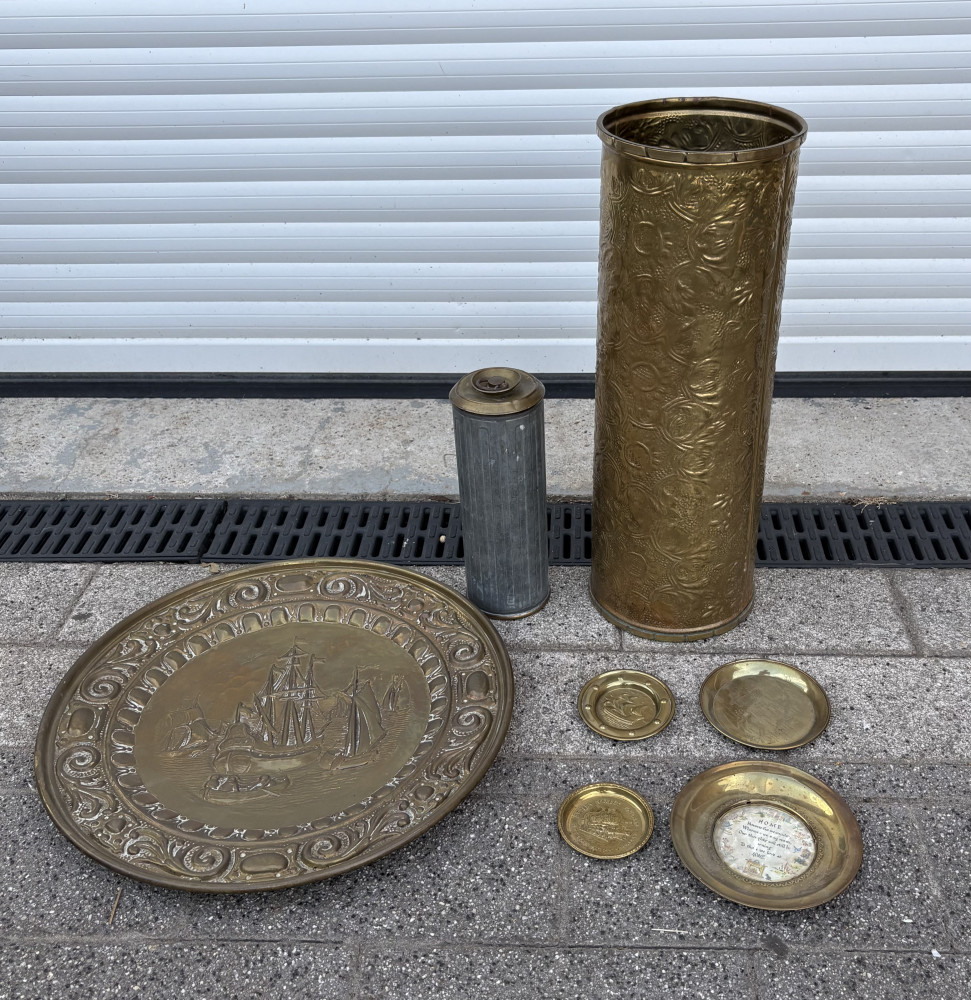 Brass charger, umbrella stand, rare hot water bottle and other brass items